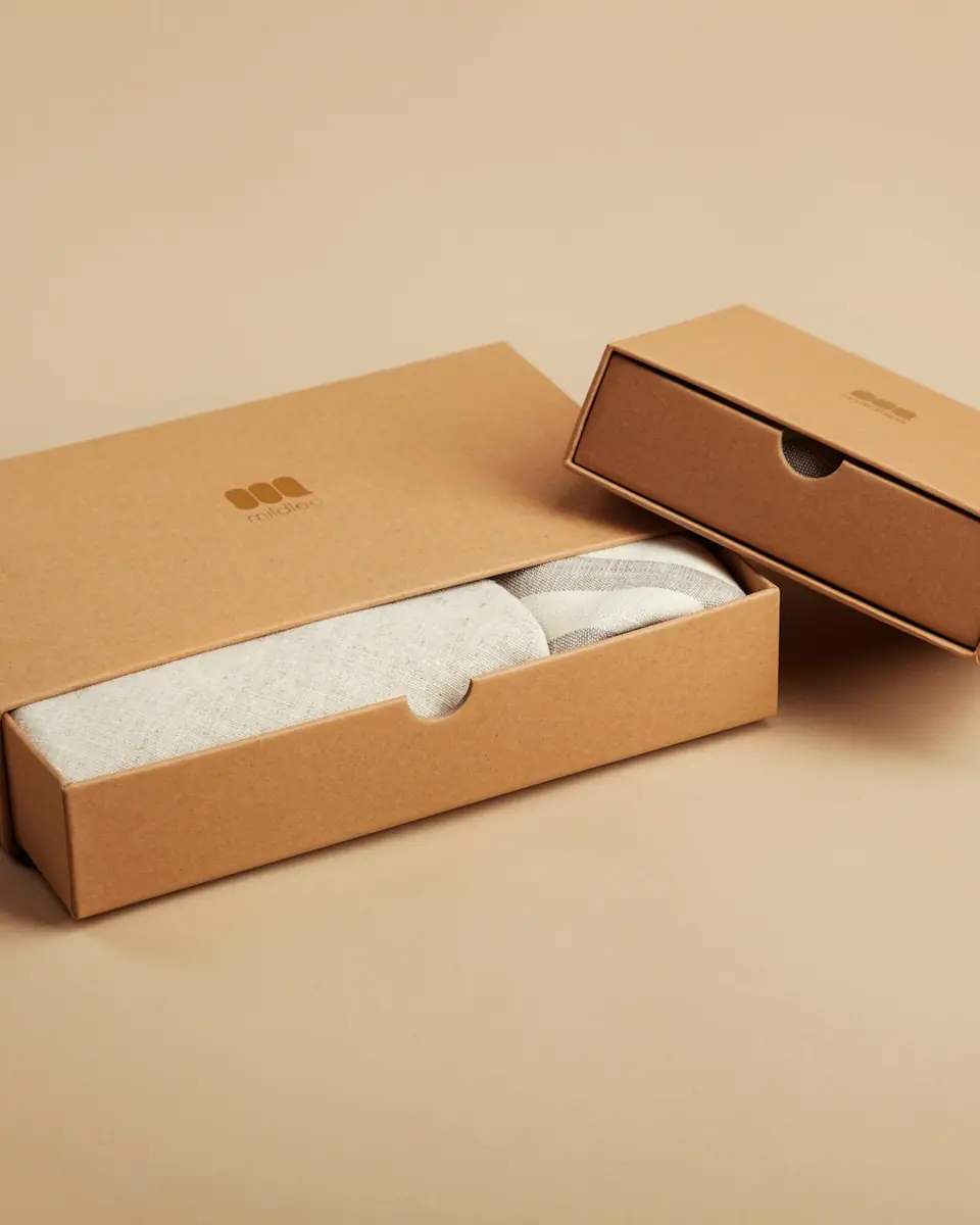 Kraft rigid box with lid resting on a white table